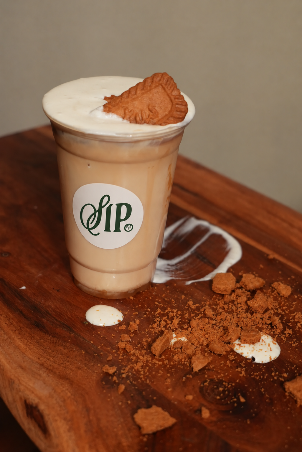 A Lotus Biscoff latte served in a branded SIP. cup
