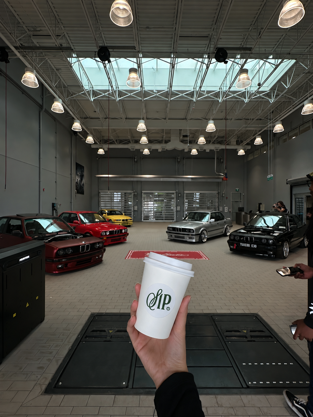 A SIP. coffee cup at a BMW event