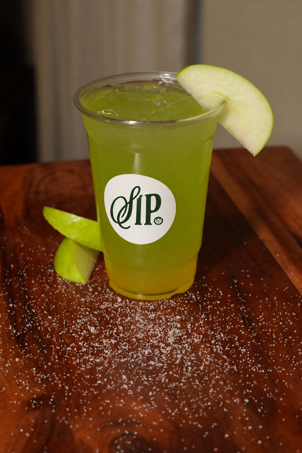 A Green Apple Passion drink garnished with fresh apple