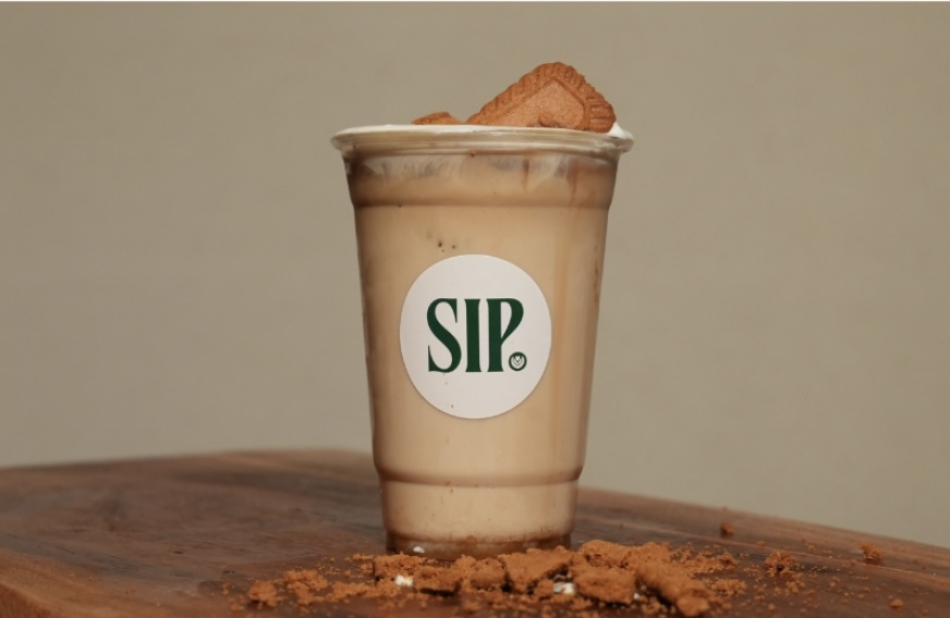 SIP. Lotus Biscoff latte topped with a Biscoff cookie
